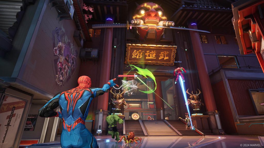 Marvel Rivals gameplay featuring Spider-Man using web abilities in a dojo-themed arena, with Iron Man, Hulk, and Rocket Raccoon fighting enemies nearby.