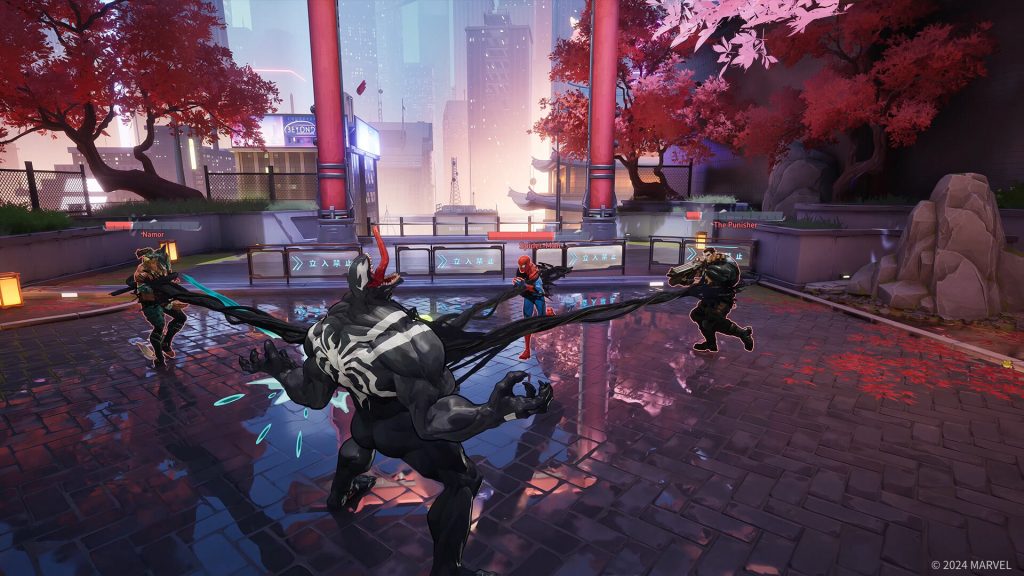 Marvel Rivals gameplay showing Venom attacking Spider-Man while Namor and The Punisher prepare for battle in a neon-lit arena with cherry blossom trees.