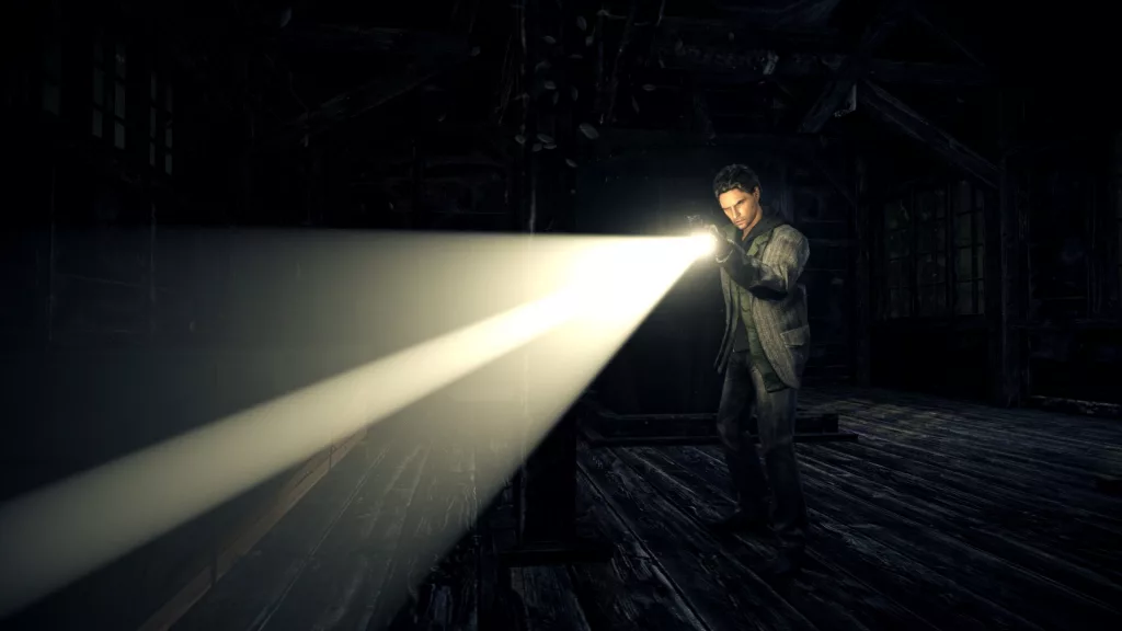 Alan Wake shining a flashlight inside a dark wooden cabin.