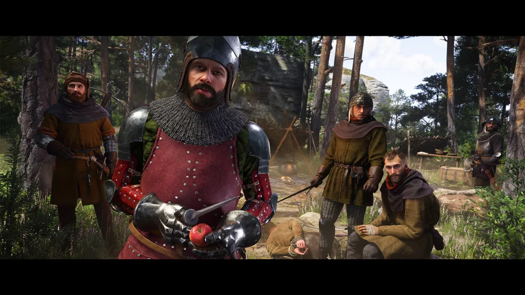 A medieval knight in red armor holding an apple, surrounded by soldiers and a subdued prisoner in a forest encampment in Kingdom Come: Deliverance 2.