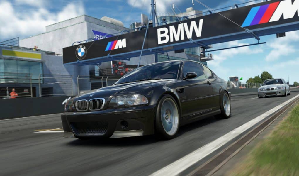 A realistic screenshot from the sim racing game Assetto Corsa EVO showing a black BMW M3 E46 CSL speeding down a race track, with a large BMW banner visible above the track.