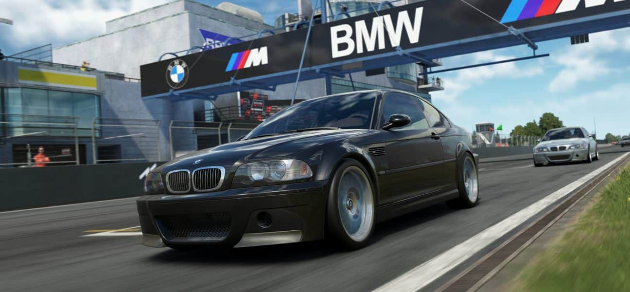 A realistic screenshot from the sim racing game Assetto Corsa EVO showing a black BMW M3 E46 CSL speeding down a race track, with a large BMW banner visible above the track.