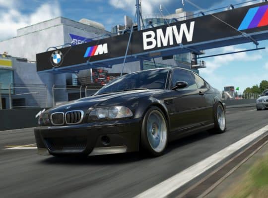 A realistic screenshot from the sim racing game Assetto Corsa EVO showing a black BMW M3 E46 CSL speeding down a race track, with a large BMW banner visible above the track.