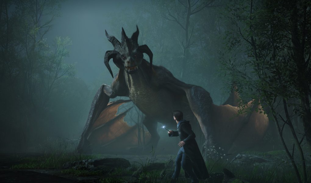 A dramatic screenshot from Hogwarts Legacy showing a student wizard standing bravely in a misty forest, aiming his wand at a large, fierce-looking dragon with prominent horns and leathery wings.