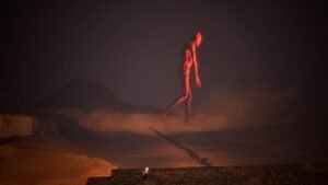 Ayasa: Shadows of Silence screenshot: a red humanoid figure standing on a dark horizon