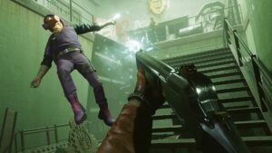 Deathloop screenshot: A first-person view of Colt kicking an enemy off a staircase