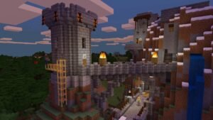 Minecraft screenshot: A stone castle with towers, torches and a bridge over a valley at dusk
