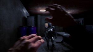 The Transference screenshot: a dim room with a figure and the player's hands in view