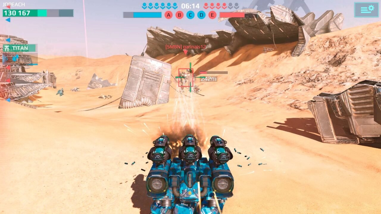 War Robots screenshot: a blue mech fires missiles across a desert battlefield towards wrecked structures, with the match HUD at the top